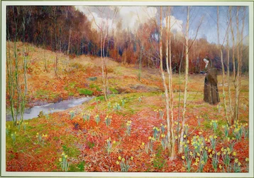 Een landschap in de lente, met een non wandelend tussen narcissen